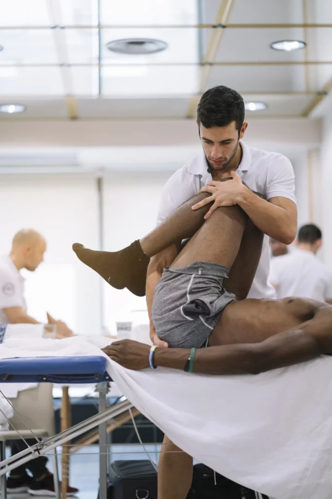 the physiotherapist treating a man using equipment 2023 11 27 05 07 35 utc 1